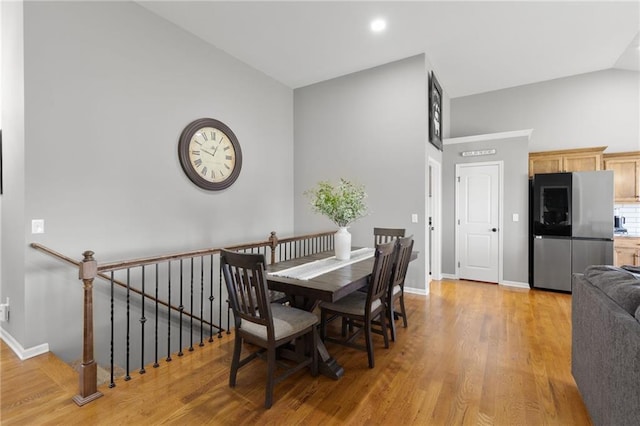 16910 Juniper Dr, Basehor, KS 66007 - dining room with light wood finished floors and high vaulted ceiling