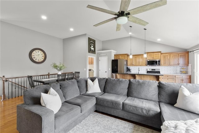 16910 Juniper Dr, Basehor, KS 66007 - living room with a ceiling fan, lofted ceiling, light wood finished floors, and recessed lighting