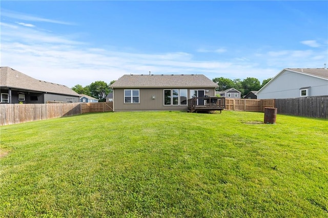 16910 Juniper Dr, Basehor, KS 66007 - back of house with a fenced backyard and a wooden deck