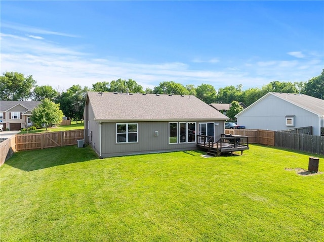 16910 Juniper Dr, Basehor, KS 66007 - rear view of house featuring a fenced backyard, a deck, and a shingled roof