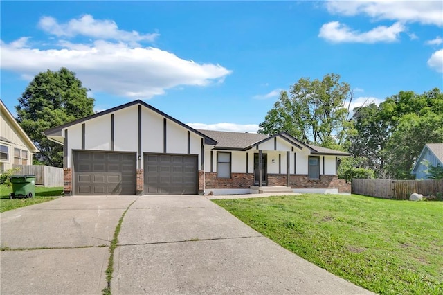 11704 E 76th Ter, Raytown, MO 64138 - view of front of house with brick siding, a garage, driveway, and stucco siding