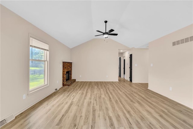 11704 E 76th Ter, Raytown, MO 64138 - unfurnished living room featuring ceiling fan, light wood-type flooring, lofted ceiling, a brick fireplace, and baseboards