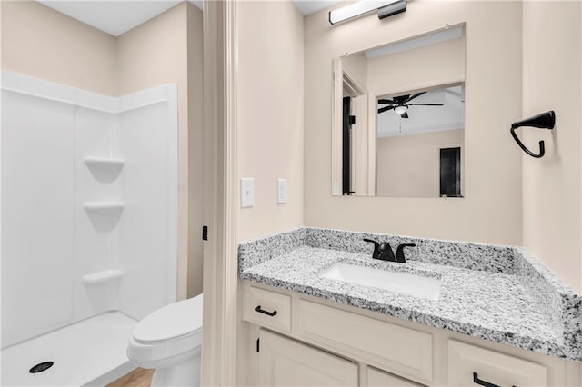 11704 E 76th Ter, Raytown, MO 64138 - full bathroom featuring vanity, a shower, a ceiling fan, and toilet