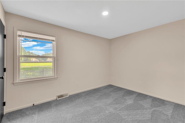11704 E 76th Ter, Raytown, MO 64138 - spare room featuring carpet flooring, baseboards, and recessed lighting