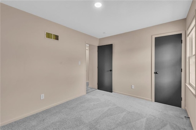 11704 E 76th Ter, Raytown, MO 64138 - unfurnished bedroom with carpet, baseboards, and recessed lighting