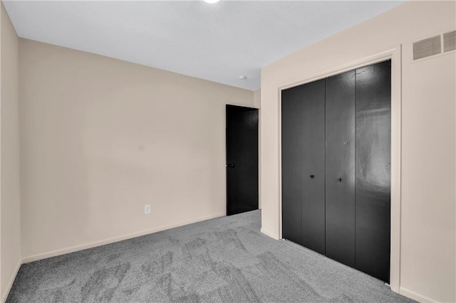 11704 E 76th Ter, Raytown, MO 64138 - unfurnished bedroom with carpet floors, a closet, and baseboards