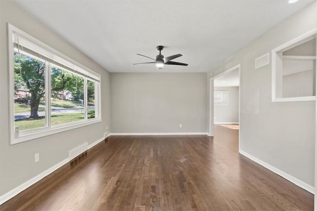 9741 Walnut St, Kansas City, MO 64114 - unfurnished room with dark wood-style flooring and a ceiling fan