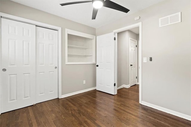 9741 Walnut St, Kansas City, MO 64114 - unfurnished bedroom with wood finished floors, ceiling fan, and a closet