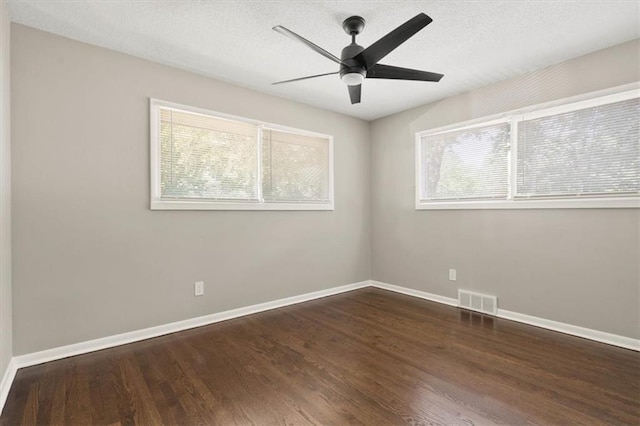9741 Walnut St, Kansas City, MO 64114 - spare room featuring wood finished floors, ceiling fan, and a textured ceiling