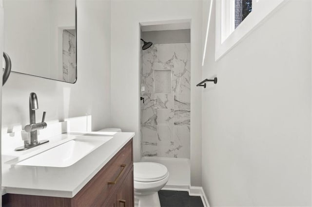 9741 Walnut St, Kansas City, MO 64114 - bathroom featuring a marble finish shower and vanity