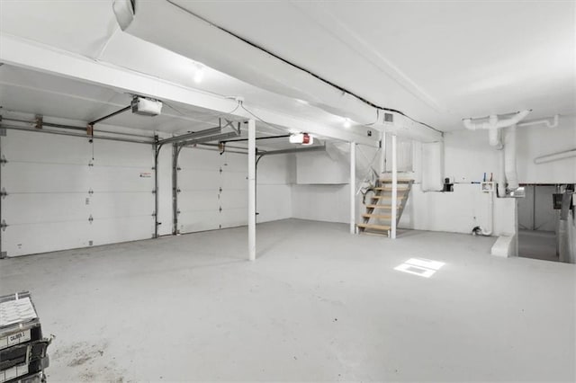 9741 Walnut St, Kansas City, MO 64114 - garage featuring a garage door opener