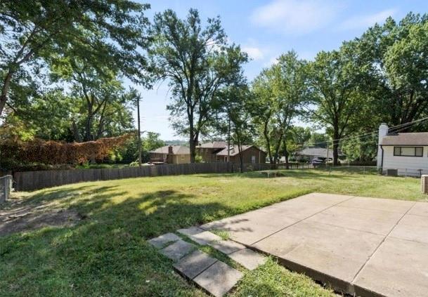 9741 Walnut St, Kansas City, MO 64114 - view of yard with a patio