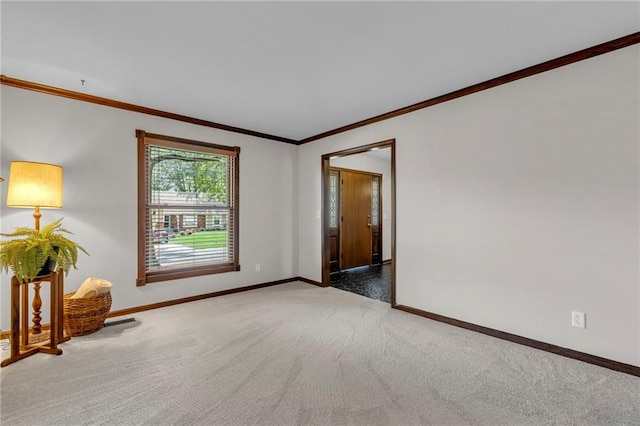10124 Halsey St, Lenexa, KS 66215 - spare room featuring carpet floors, baseboards, and crown molding