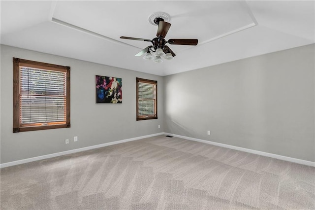 10124 Halsey St, Lenexa, KS 66215 - spare room featuring healthy amount of natural light, carpet, ceiling fan, baseboards, and lofted ceiling