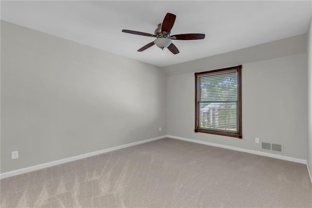 10124 Halsey St, Lenexa, KS 66215 - carpeted spare room with baseboards and ceiling fan