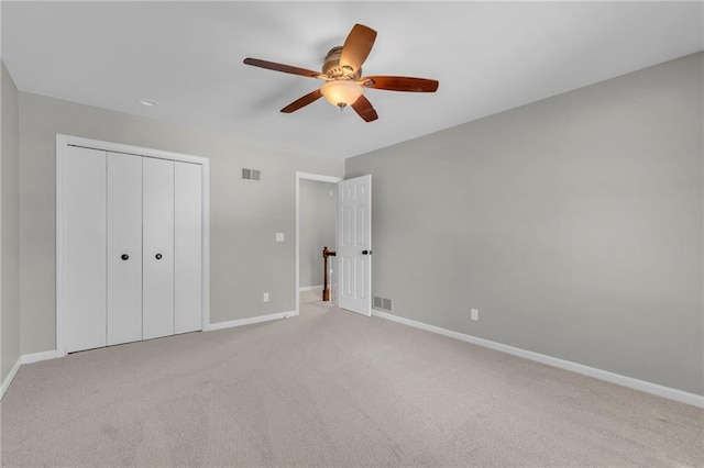 10124 Halsey St, Lenexa, KS 66215 - unfurnished bedroom with baseboards, a closet, and light carpet