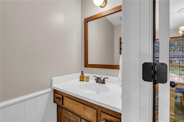10124 Halsey St, Lenexa, KS 66215 - bathroom with vanity and a wainscoted wall