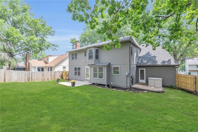 10124 Halsey St, Lenexa, KS 66215 - rear view of property with a patio and a chimney