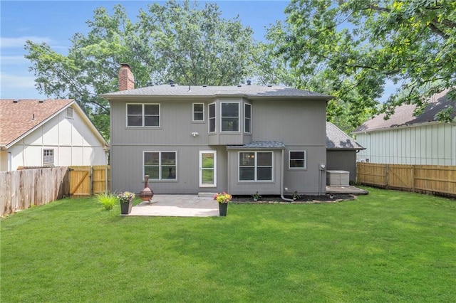 10124 Halsey St, Lenexa, KS 66215 - back of property with a patio area, a chimney, and roof with shingles
