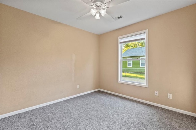739 S Cypress St, Ottawa, KS 66067 - carpeted spare room with a ceiling fan and baseboards