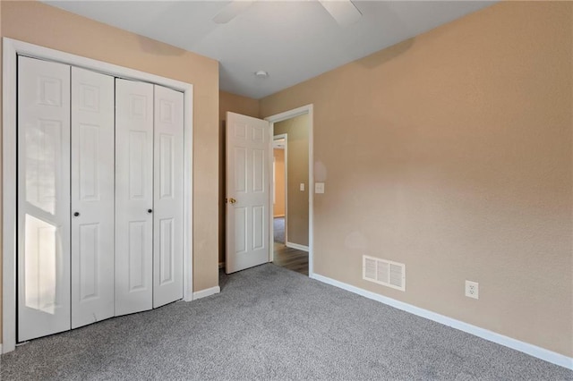 739 S Cypress St, Ottawa, KS 66067 - unfurnished bedroom featuring carpet flooring, a closet, and a ceiling fan
