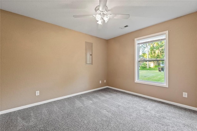 739 S Cypress St, Ottawa, KS 66067 - carpeted empty room featuring electric panel and a ceiling fan