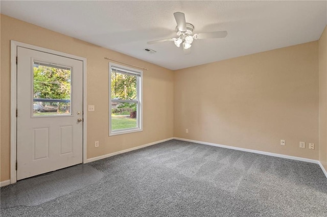 739 S Cypress St, Ottawa, KS 66067 - carpeted empty room featuring baseboards and a ceiling fan