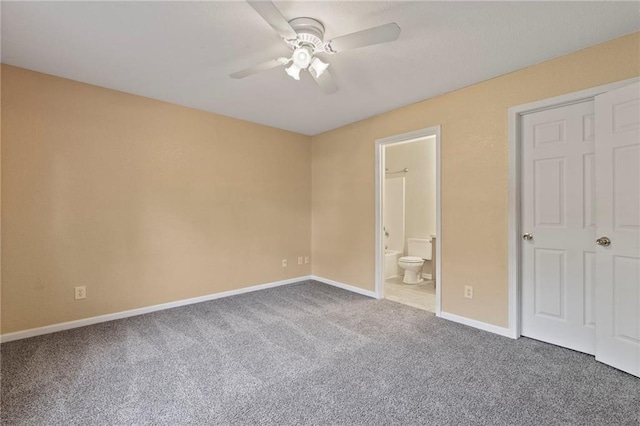 739 S Cypress St, Ottawa, KS 66067 - unfurnished bedroom featuring carpet flooring, connected bathroom, and a ceiling fan