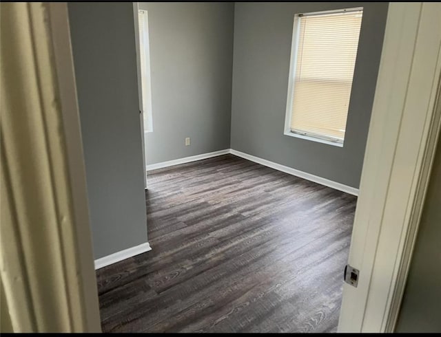 106 Saratoga St, Excelsior Springs, MO 64024 - unfurnished room featuring dark wood-style floors and baseboards