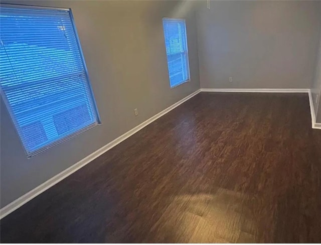 106 Saratoga St, Excelsior Springs, MO 64024 - empty room featuring wood finished floors and plenty of natural light