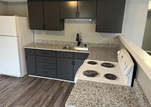 106 Saratoga St, Excelsior Springs, MO 64024 - kitchen with white appliances and dark wood finished floors