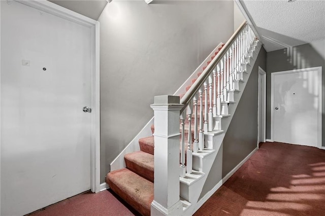 106 Saratoga St, Excelsior Springs, MO 64024 - staircase with carpet flooring and a textured ceiling