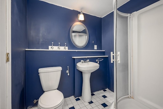 12655 S Clinton St, Olathe, KS 66061 - full bath featuring toilet, a shower stall, and tile patterned floors