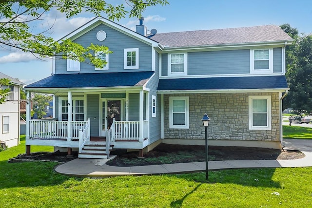 12655 S Clinton St, Olathe, KS 66061 - view of front of property featuring covered porch, stone siding, a chimney, and a front lawn