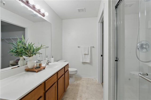 5610 NE 80th Ter Unit 1D, Kansas City, MO 64119 - bathroom featuring toilet, vanity, a shower stall, and baseboards