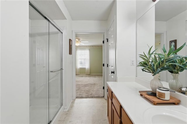 5610 NE 80th Ter Unit 1D, Kansas City, MO 64119 - full bathroom with a shower stall, vanity, ceiling fan, and tile patterned floors