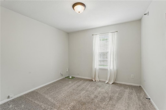 5610 NE 80th Ter Unit 1D, Kansas City, MO 64119 - carpeted spare room featuring baseboards