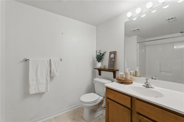5610 NE 80th Ter Unit 1D, Kansas City, MO 64119 - full bath featuring a shower, vanity, toilet, a textured ceiling, and baseboards