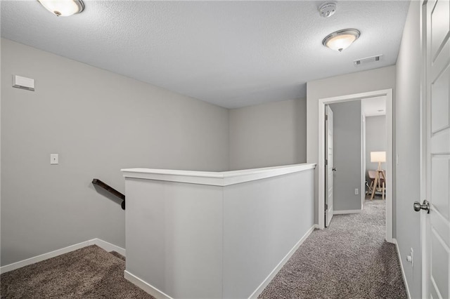 16059 Fontana St Unit 204, Overland Park, KS 66085 - hallway with an upstairs landing, carpet, a textured ceiling, and baseboards
