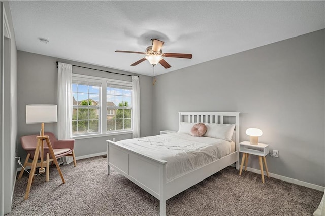 16059 Fontana St Unit 204, Overland Park, KS 66085 - carpeted bedroom featuring baseboards, a textured ceiling, and ceiling fan