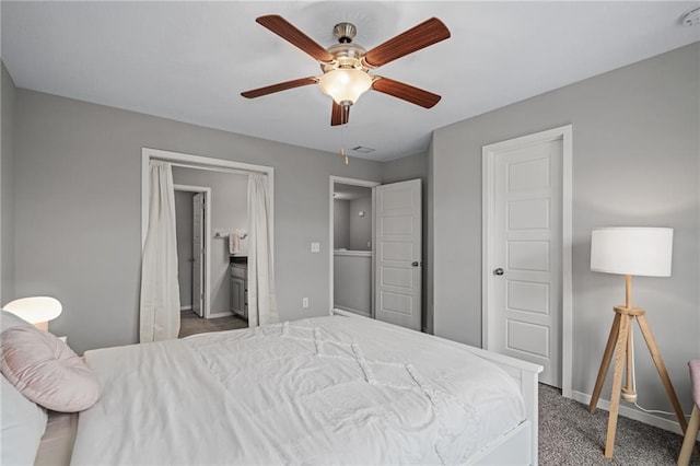 16059 Fontana St Unit 204, Overland Park, KS 66085 - carpeted bedroom featuring baseboards, ceiling fan, and ensuite bath