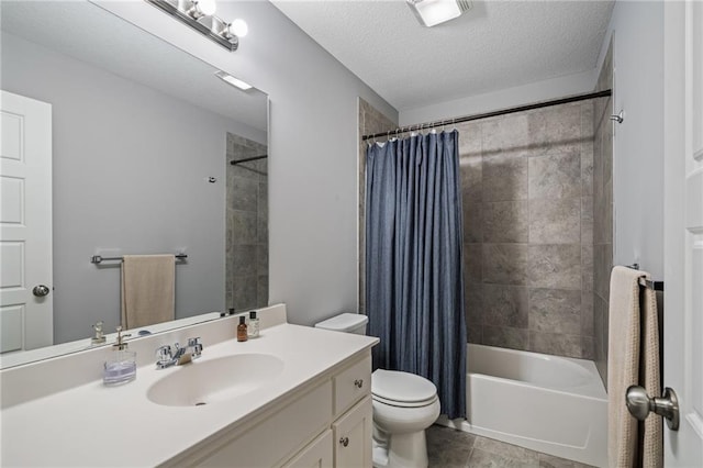 16059 Fontana St Unit 204, Overland Park, KS 66085 - bathroom with vanity, toilet, shower / bath combo, tile patterned flooring, and a textured ceiling