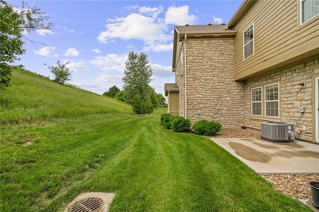 16059 Fontana St Unit 204, Overland Park, KS 66085 - view of grassy yard featuring central AC unit and a patio