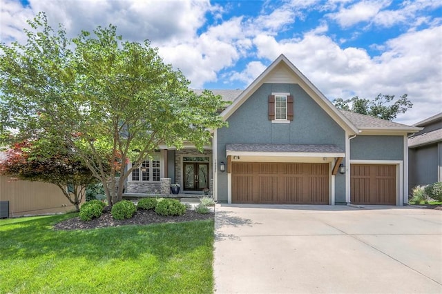 14095 NW 60th Ct, Parkville, MO 64152 - view of front facade featuring stucco siding, driveway, a front lawn, and a garage