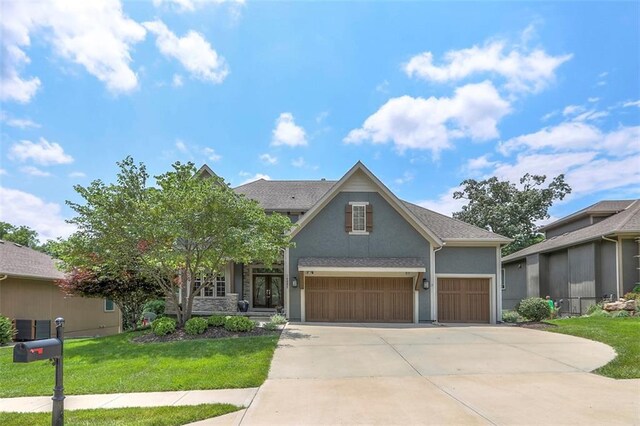 14095 NW 60th Ct, Parkville, MO 64152 - traditional-style house with concrete driveway, stucco siding, a front lawn, and an attached garage