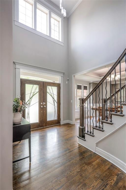 14095 NW 60th Ct, Parkville, MO 64152 - foyer featuring a towering ceiling, french doors, stairs, wood finished floors, and ornamental molding