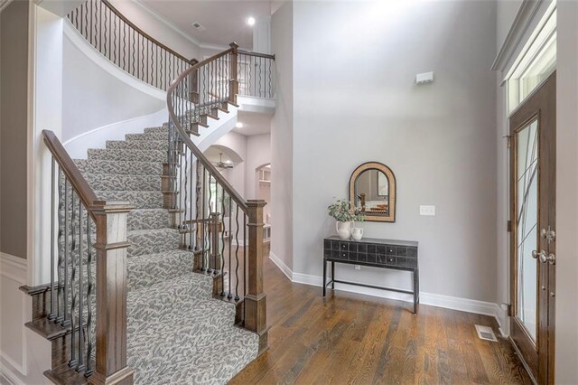 14095 NW 60th Ct, Parkville, MO 64152 - foyer entrance featuring a towering ceiling, stairs, wood finished floors, and recessed lighting