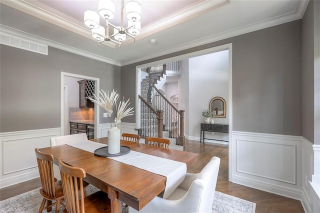 14095 NW 60th Ct, Parkville, MO 64152 - dining area featuring a chandelier, stairs, ornamental molding, wainscoting, and dark wood-style flooring