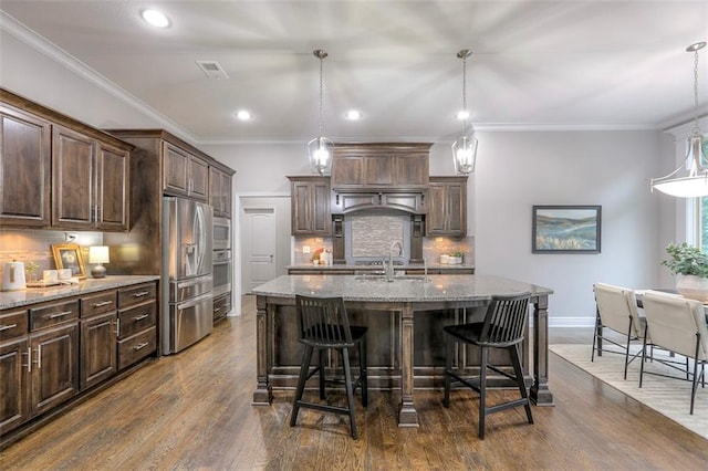 14095 NW 60th Ct, Parkville, MO 64152 - kitchen featuring stainless steel fridge, light stone counters, decorative backsplash, dark wood-style flooring, and recessed lighting
