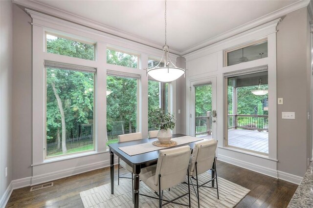 14095 NW 60th Ct, Parkville, MO 64152 - dining space featuring crown molding, healthy amount of natural light, and dark wood-style flooring